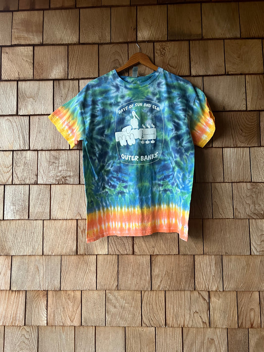 Tie-dye t-shirt with a logo on a wooden wall
