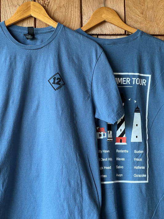 Blue t-shirt with a graphic design on a wooden surface