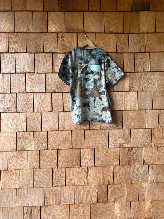 camo-patterned shirt on a wooden floor