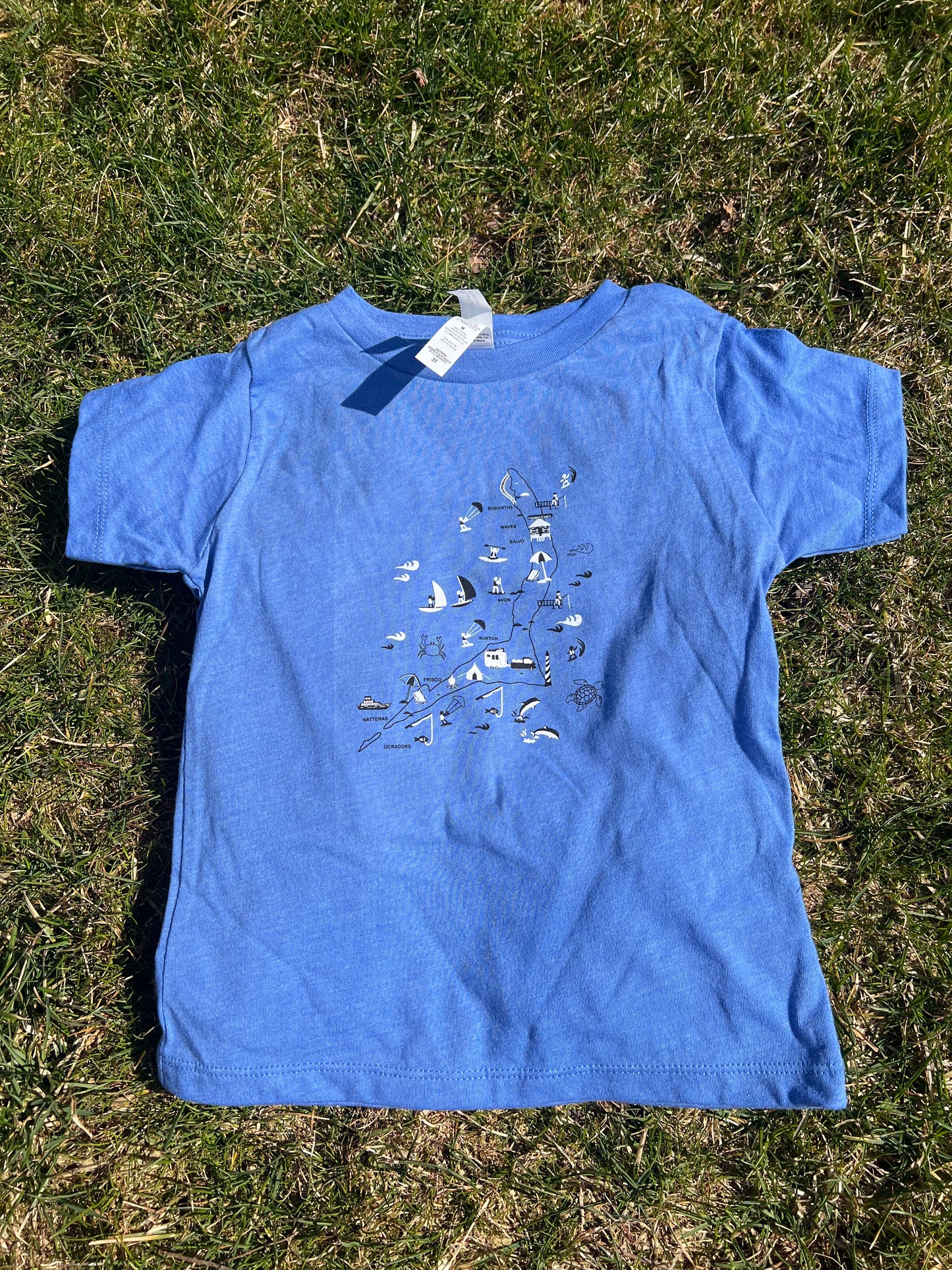 A blue toddler tee with a graphic print in the center, displayed on a flat surface.
