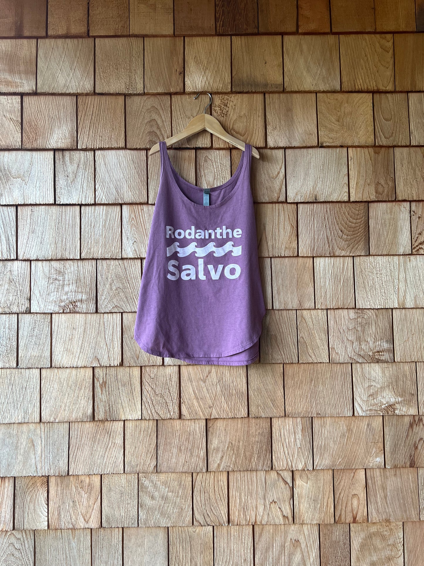 Purple tank top with 'Rodante Salvo' branding and waves logo.