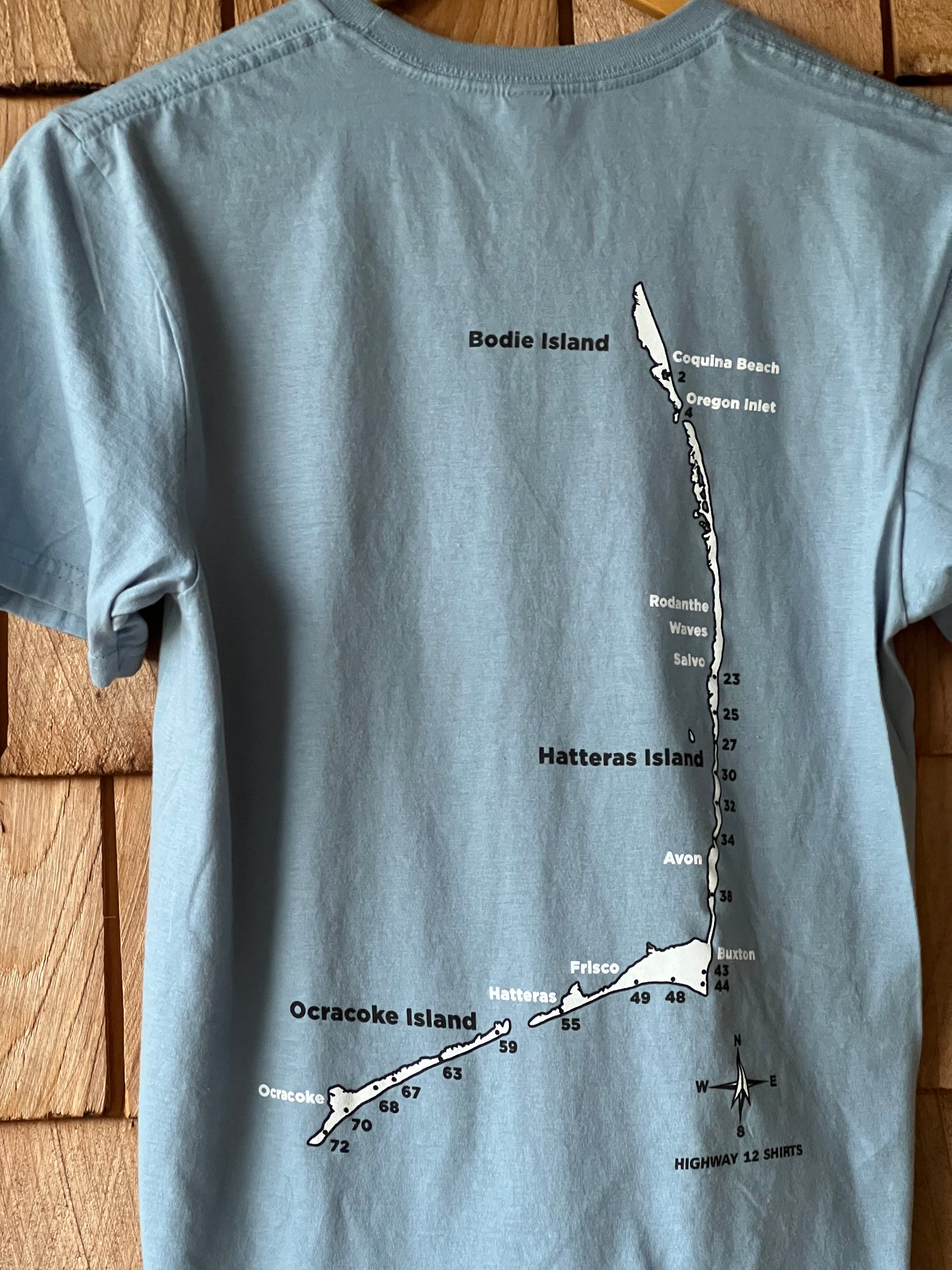 Air down short sleeve shirt with ramp map of Cape Hatteras National Seashore on back.