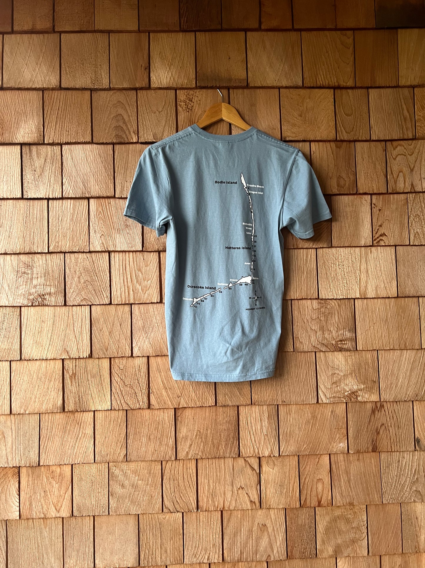 Air down short sleeve shirt with ramp map of Cape Hatteras National Seashore on back.