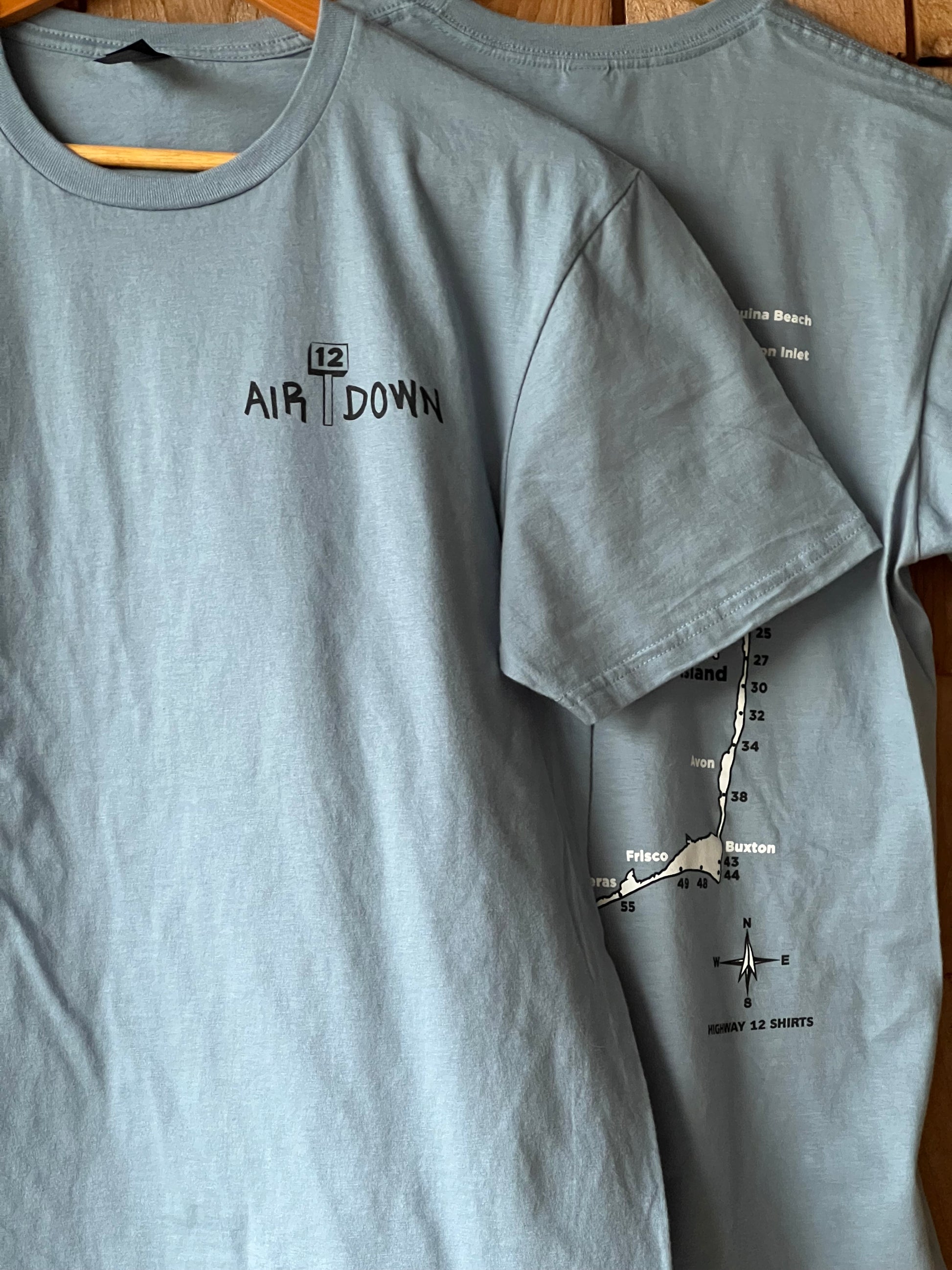 Air down short sleeve shirt with ramp map of Cape Hatteras National Seashore on back.