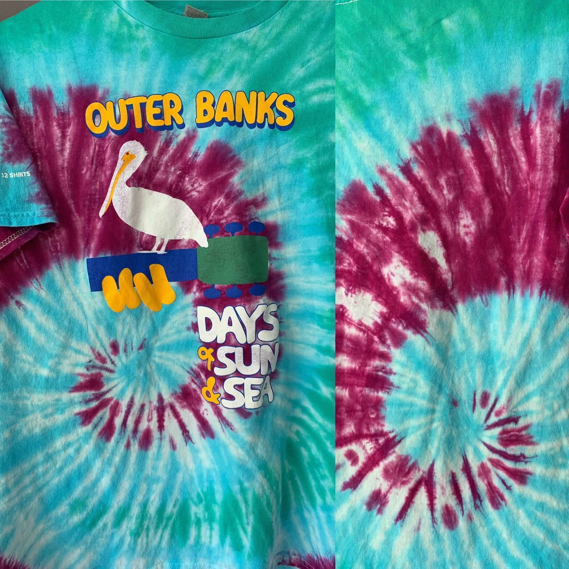 Tie-dye t-shirt with 'Outer Banks' and 'Days of Sun & Sea' text on a colorful background