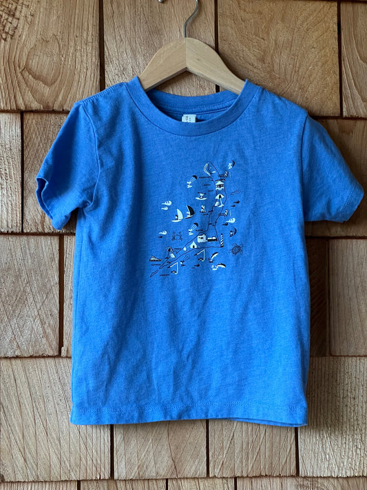 Blue t-shirt with text design on a wooden surface