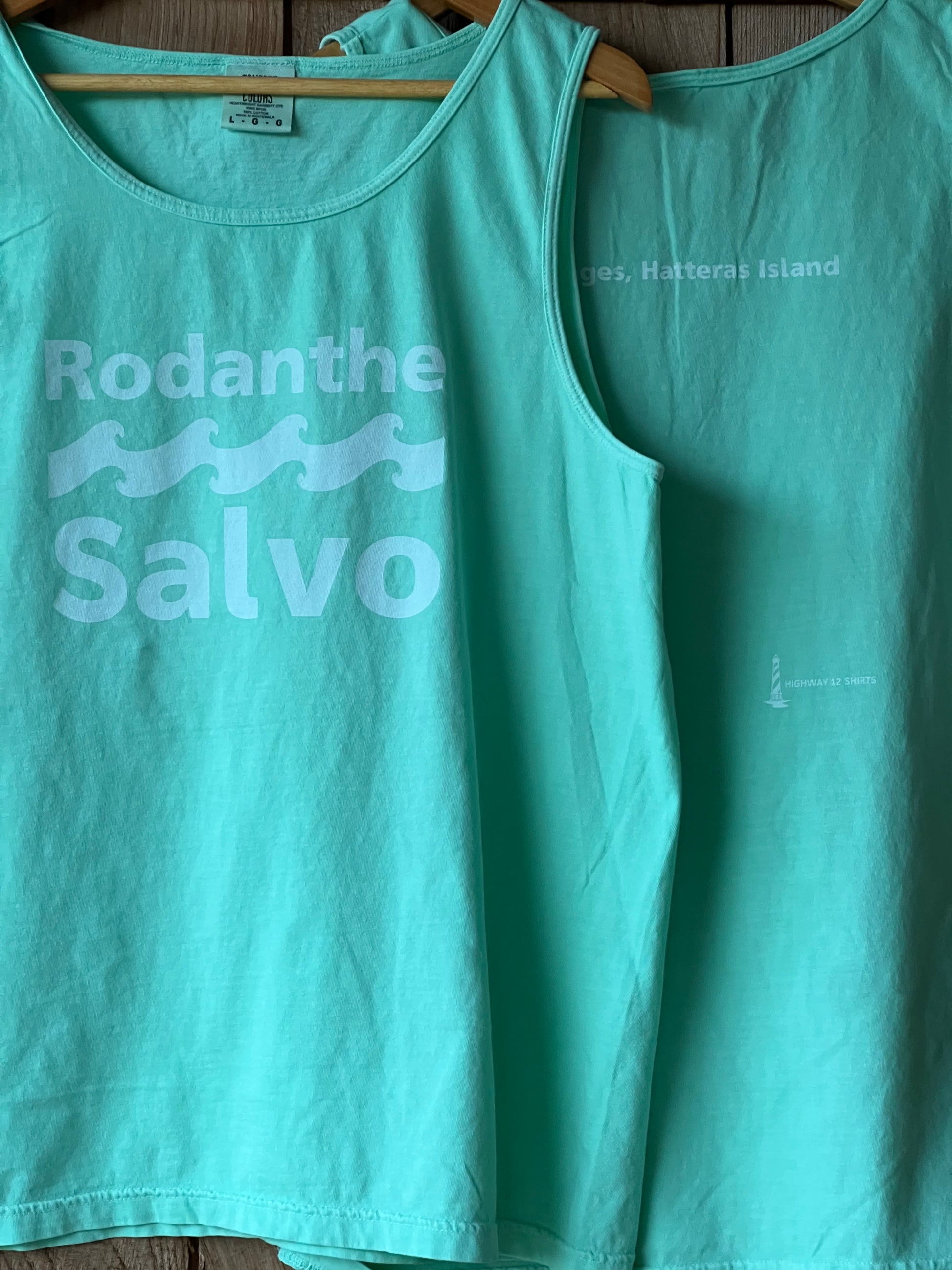 Teal tank top with 'Rodanthe Salvo' logo on a wooden surface