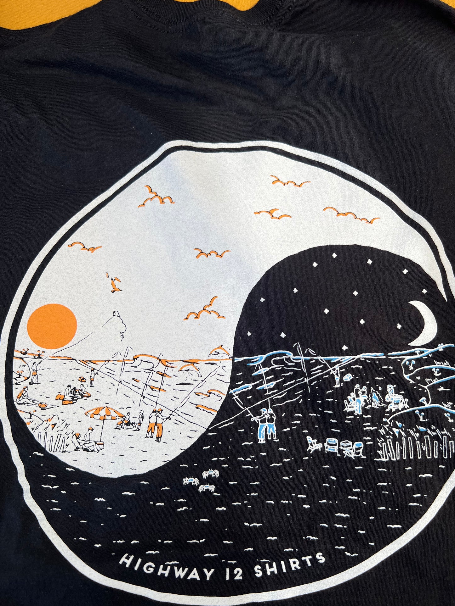 Black t-shirt with a graphic design of a moon and sun, featuring 'Highway 12 Shirts' branding.