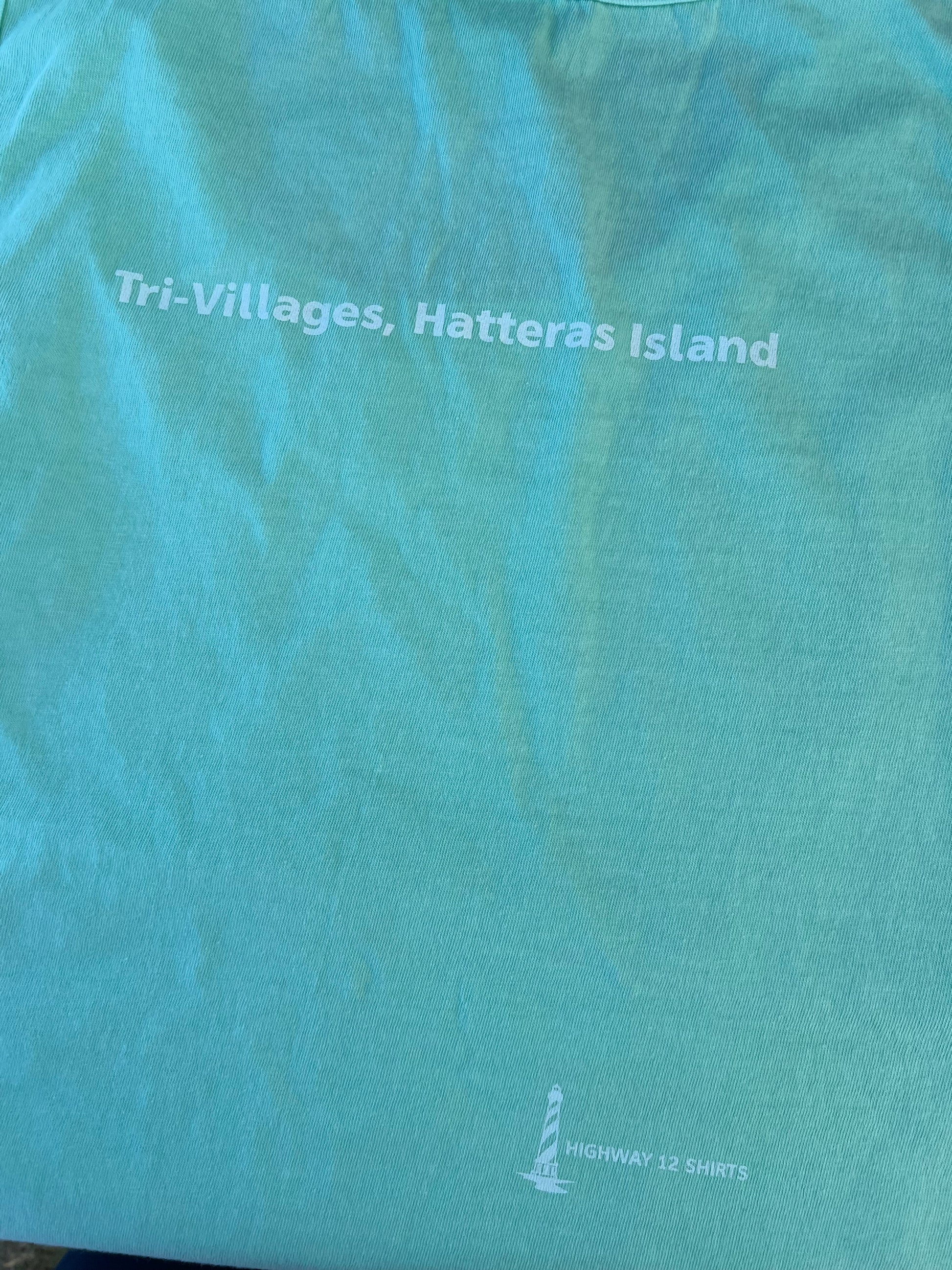 Teal fabric with text and logo on a blue background